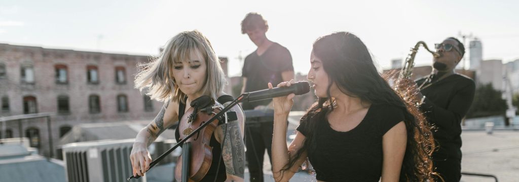 A live band playing on a roof top