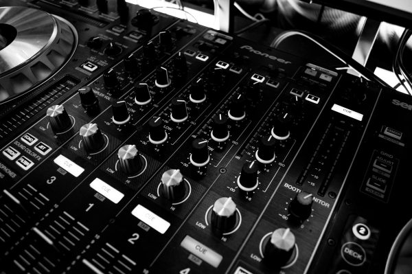 A black and white photo of DJ decks